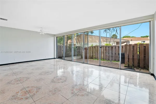 a view of an empty room with a window