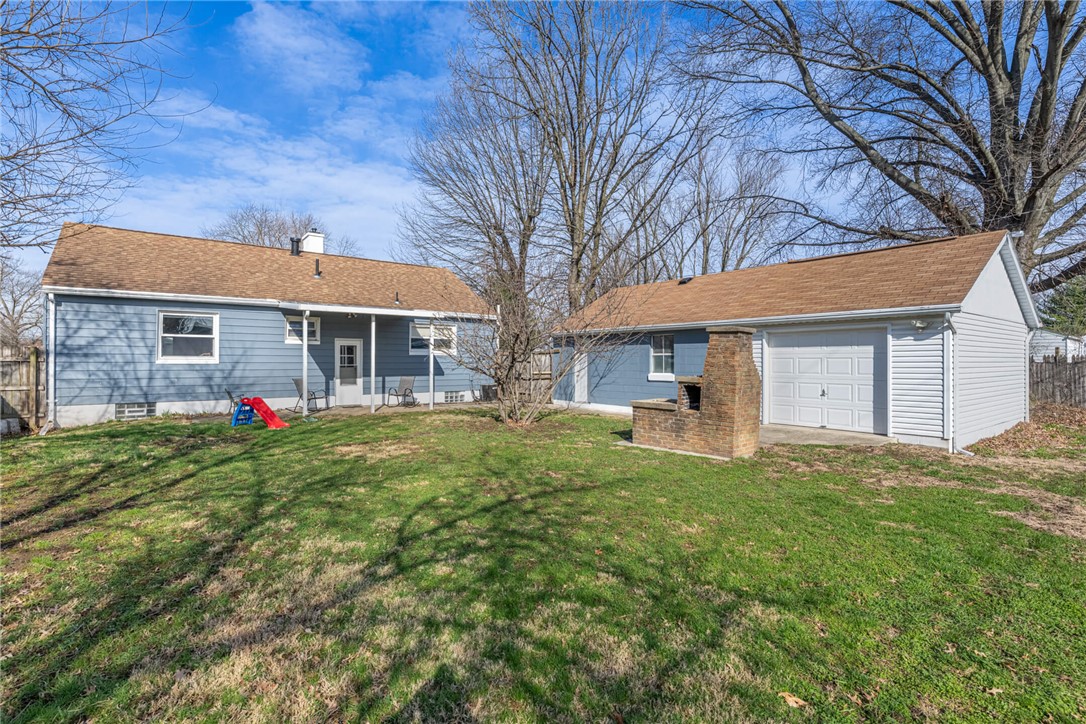 436 Marjorie Avenue Riverside, OH 45404 - Photo 29 of 34 This spacious backyard features a separate garage and a cozy outdoor fireplace, perfect for gatherings.