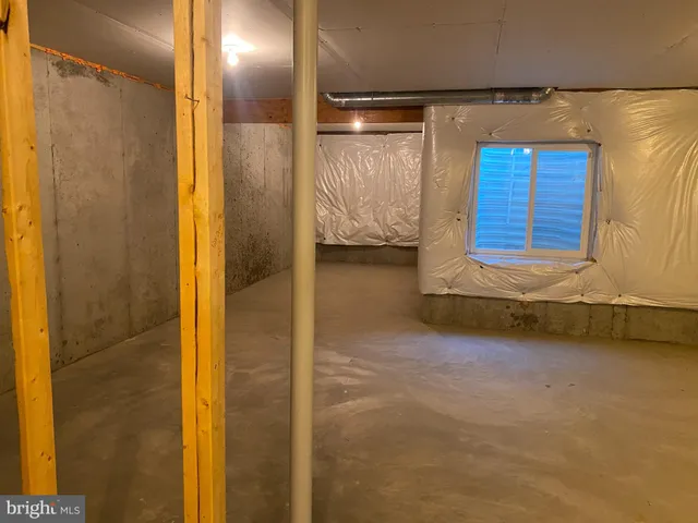 a view of a bathroom with a tub and window