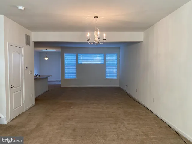 a view of a chandelier in an empty room