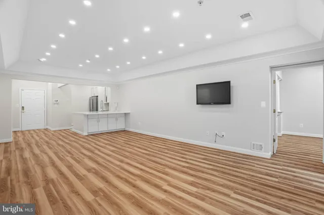 a view of a livingroom with wooden floor