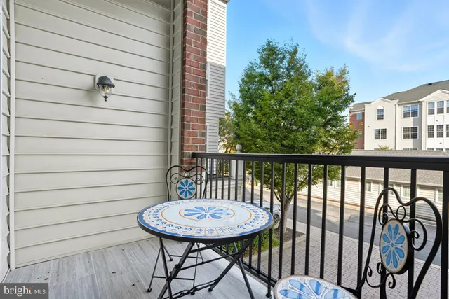 a view of a balcony with furniture