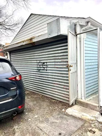 a front view of a house with parking space