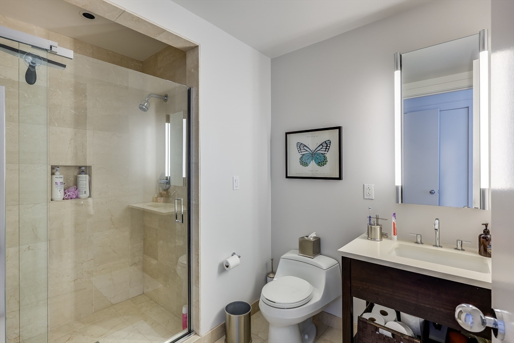 500 Atlantic Avenue, Unit PH20L Boston, MA 02210 - Photo 12 of 12 a bathroom with a sink toilet and shower