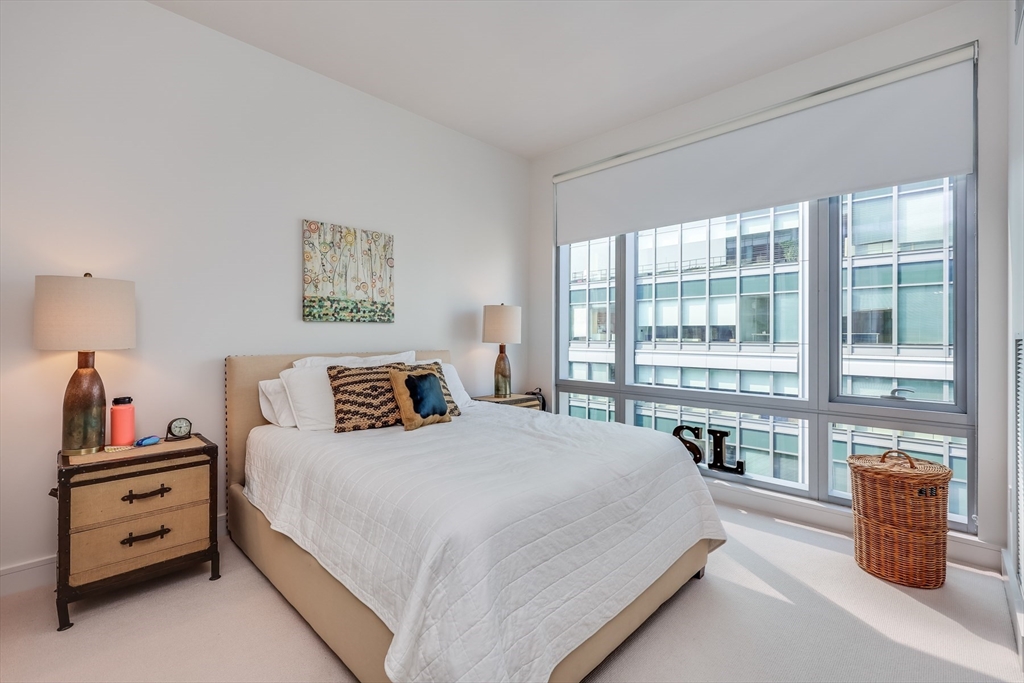 500 Atlantic Avenue, Unit PH20L Boston, MA 02210 - Photo 2 of 12 a bedroom with a large bed and a large window