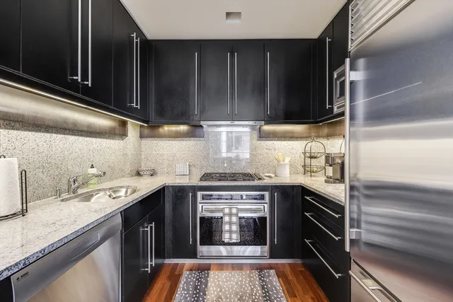 a kitchen with a stove and a sink