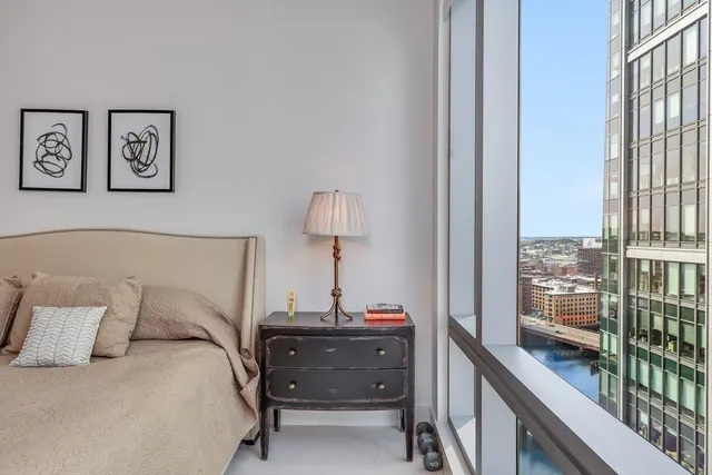 a bed room with a bed and a window