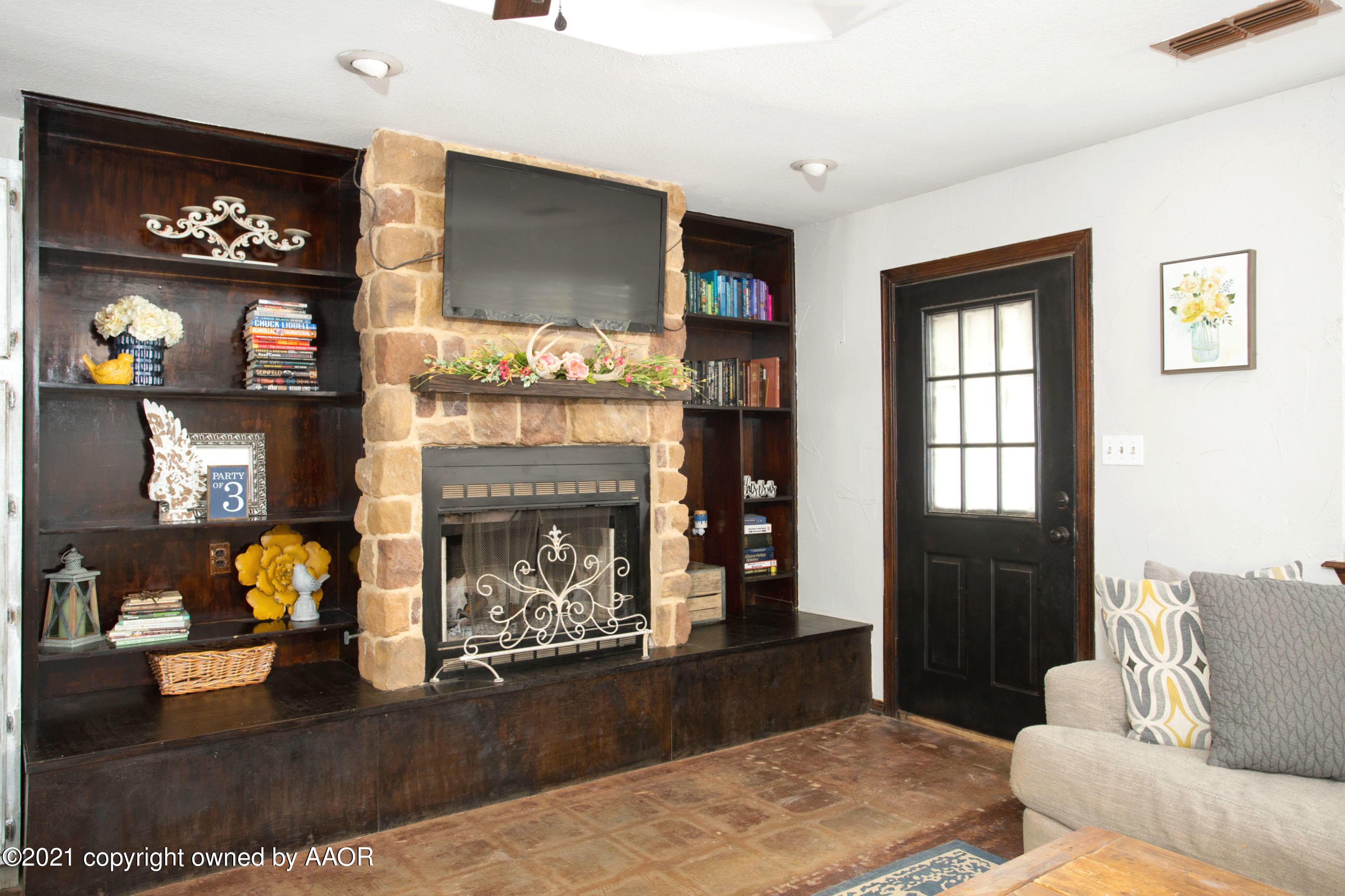 235 Cliffside Drive Amarillo, TX 79118 - Photo 3 of 39 a living room with furniture and a fireplace