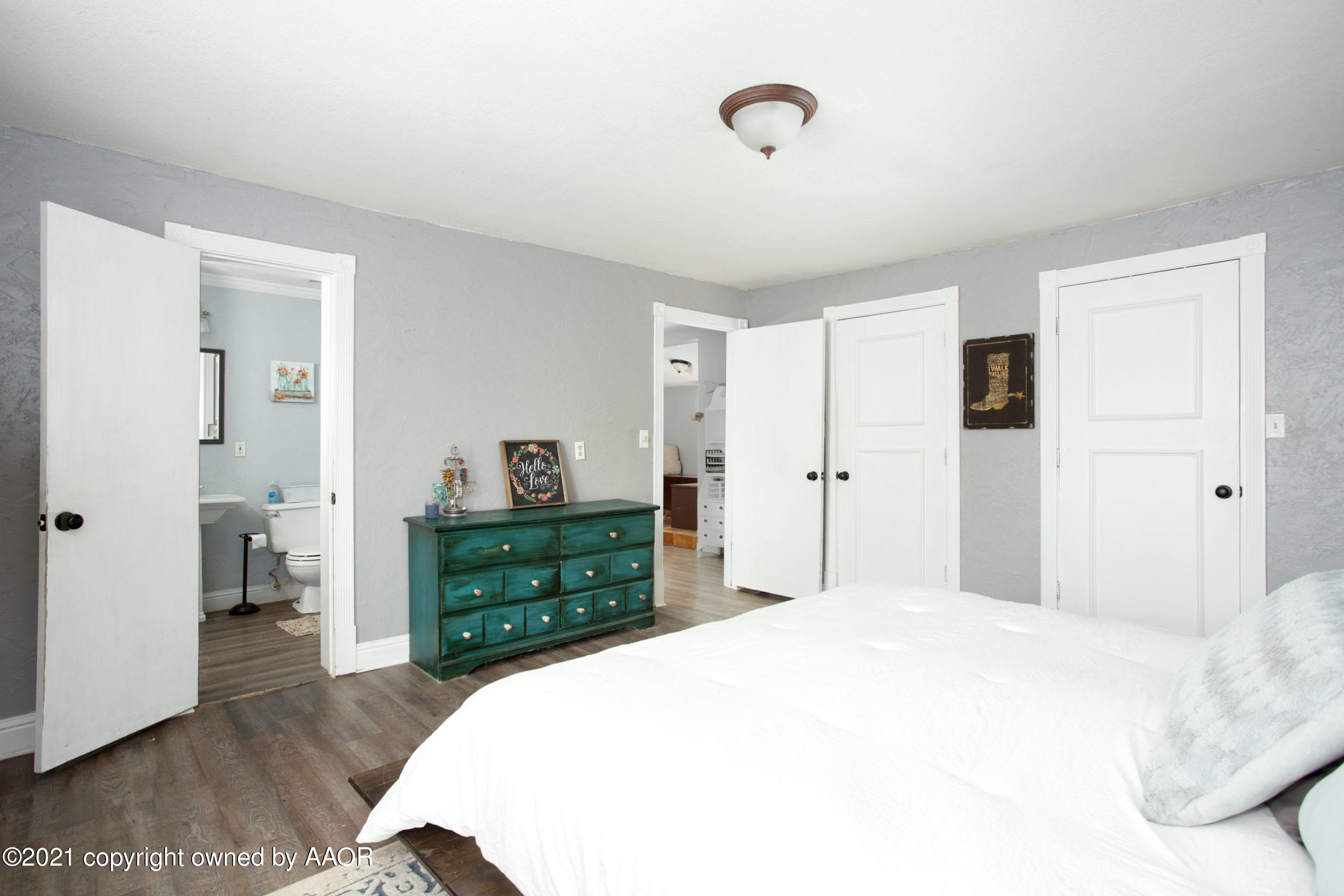 235 Cliffside Drive Amarillo, TX 79118 - Photo 21 of 39 a bedroom with a bed and a dresser