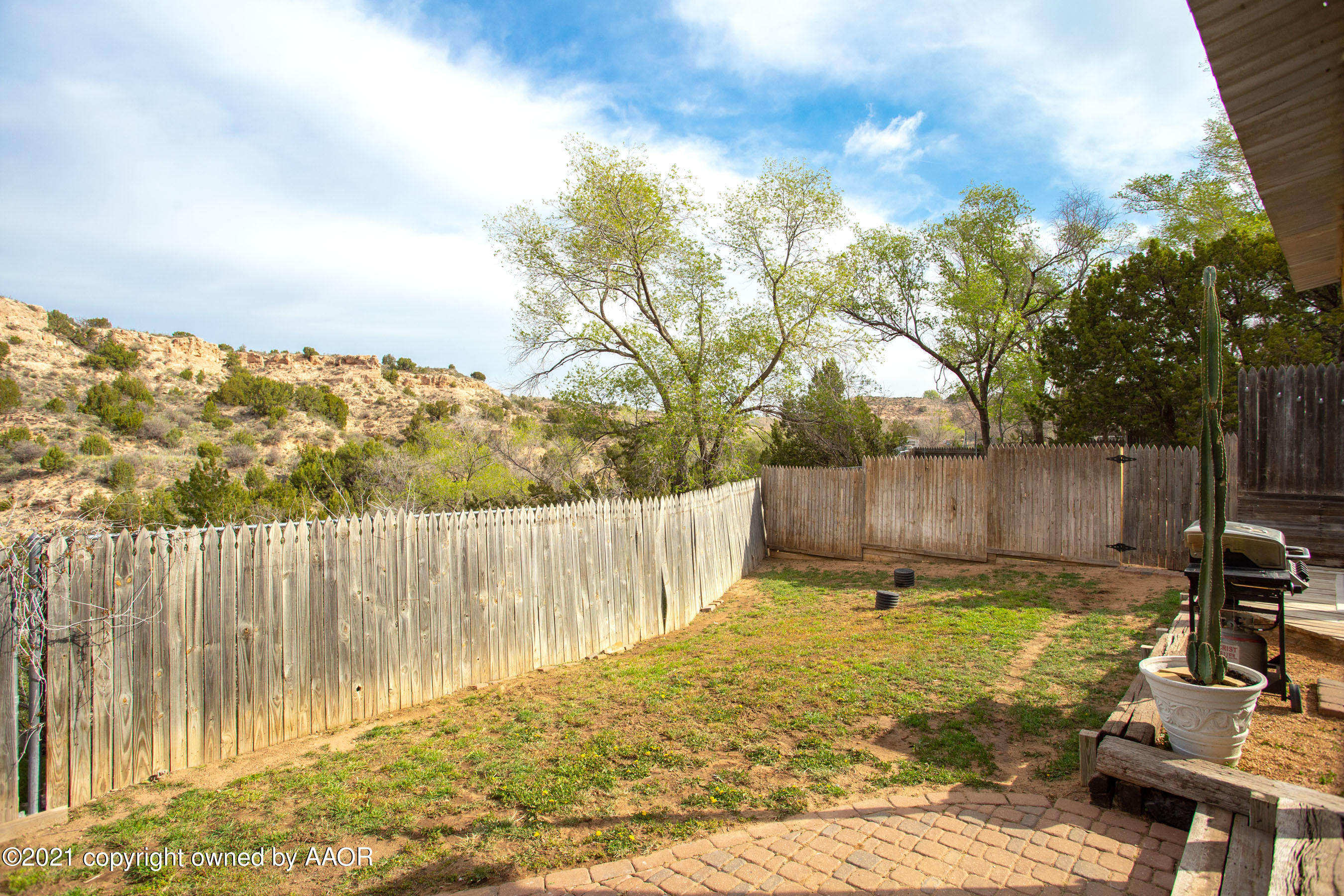 235 Cliffside Drive Amarillo, TX 79118 - Photo 32 of 39 a view of a backyard with wooden fence