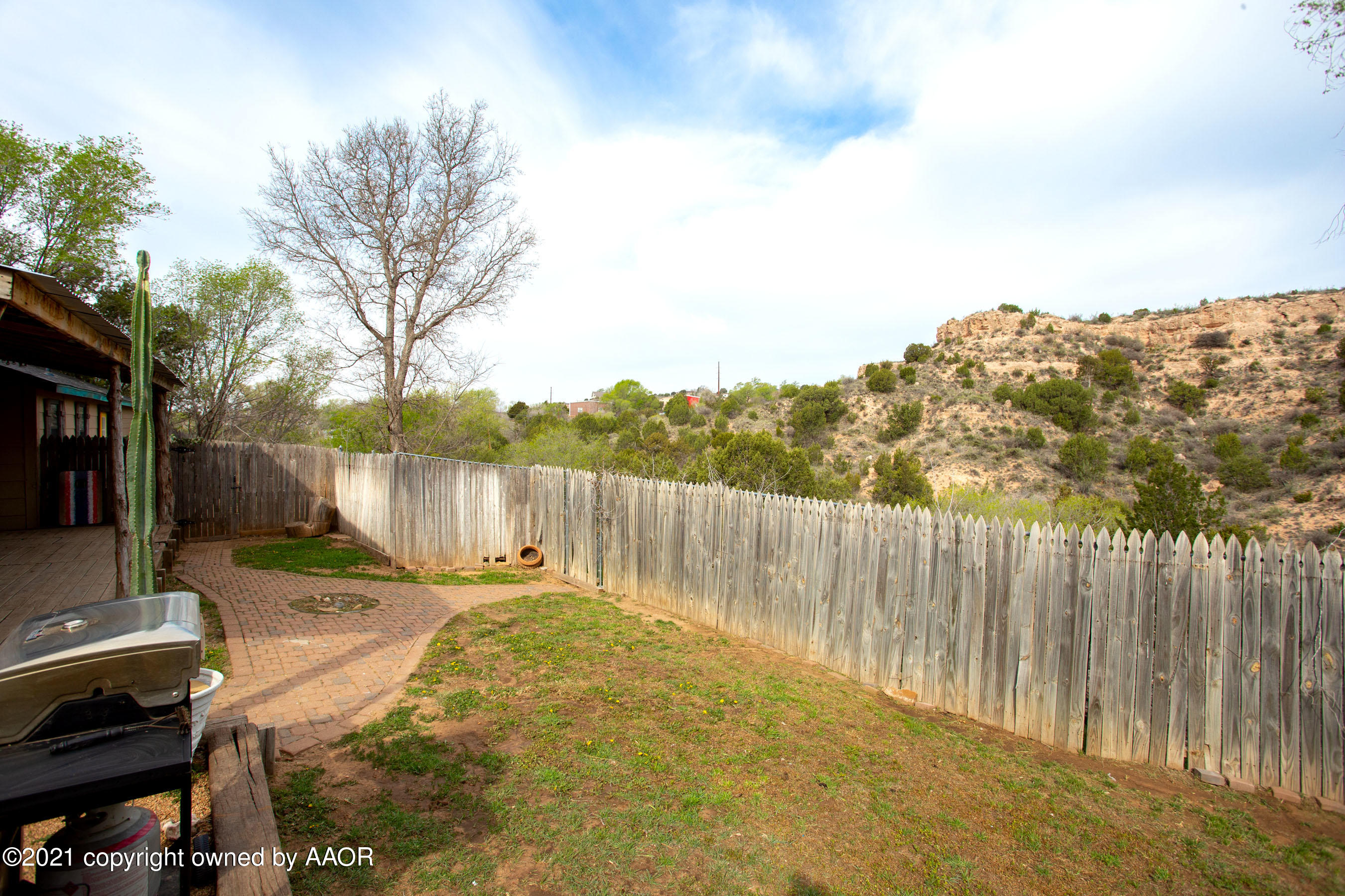 235 Cliffside Drive Amarillo, TX 79118 - Photo 33 of 39 a backyard of a house with lots of green space