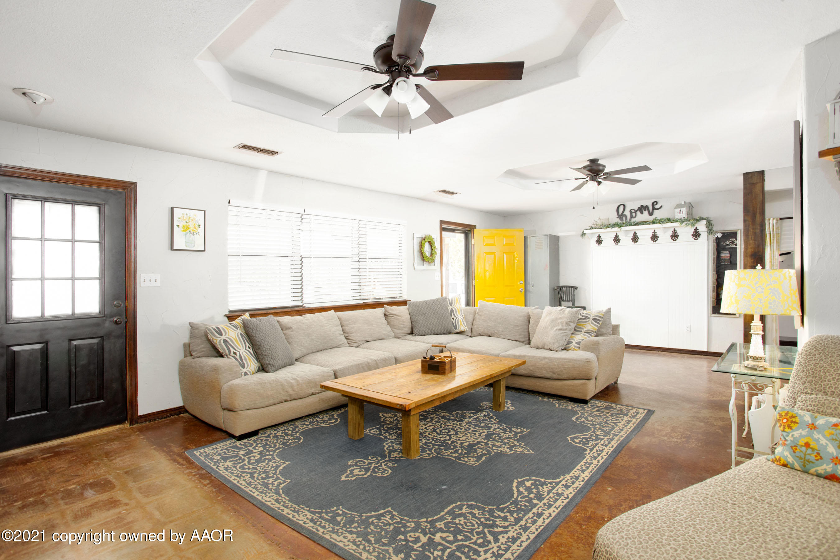 235 Cliffside Drive Amarillo, TX 79118 - Photo 5 of 39 a living room with furniture a chandelier and a table