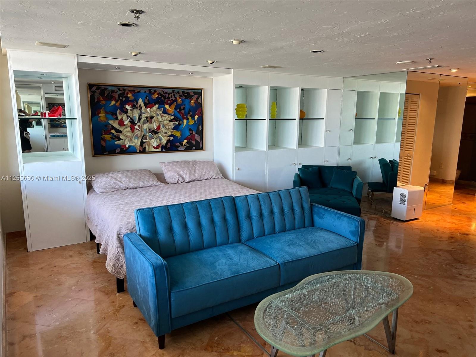 100 Lincoln Road, Unit 1228 Miami Beach, FL 33139 - Photo 13 of 70 a living room with furniture and a flat screen tv