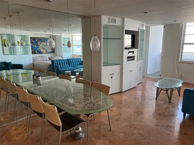 a kitchen with refrigerator a sink and cabinets