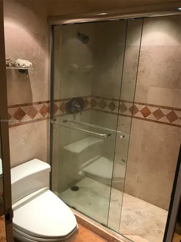 a view of a hallway with a chandelier