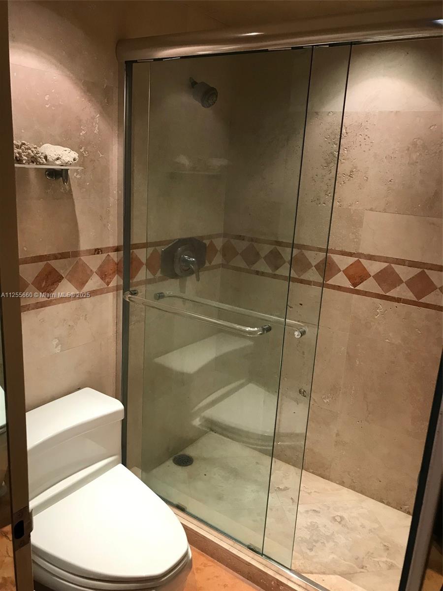 100 Lincoln Road, Unit 1228 Miami Beach, FL 33139 - Photo 25 of 70 a bathroom with a toilet and a shower