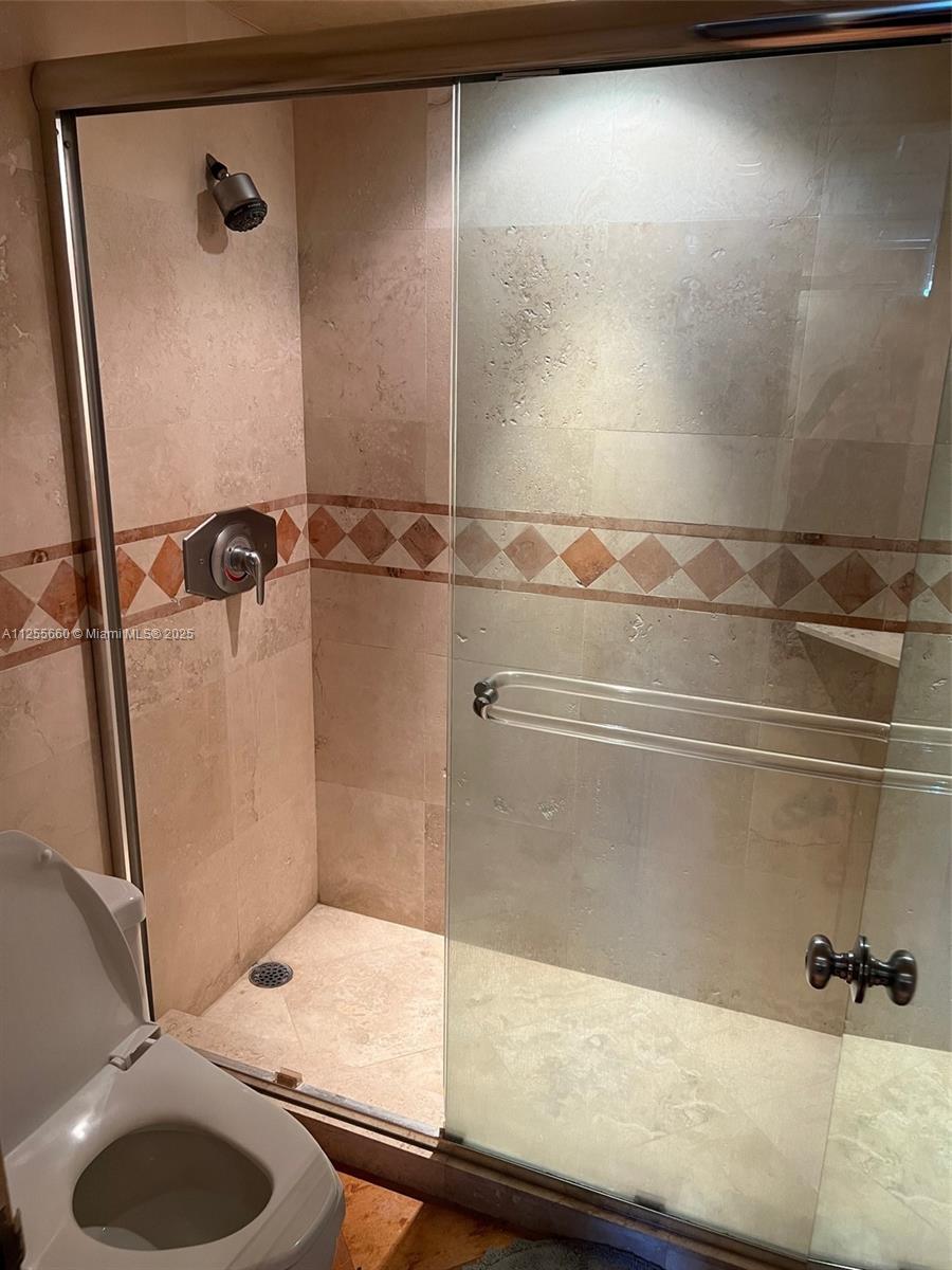 100 Lincoln Road, Unit 1228 Miami Beach, FL 33139 - Photo 27 of 70 a bathroom with a shower and a sink