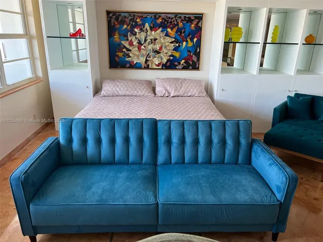 a living room with furniture and a window