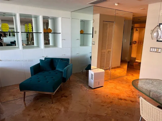 a living room with furniture and windows