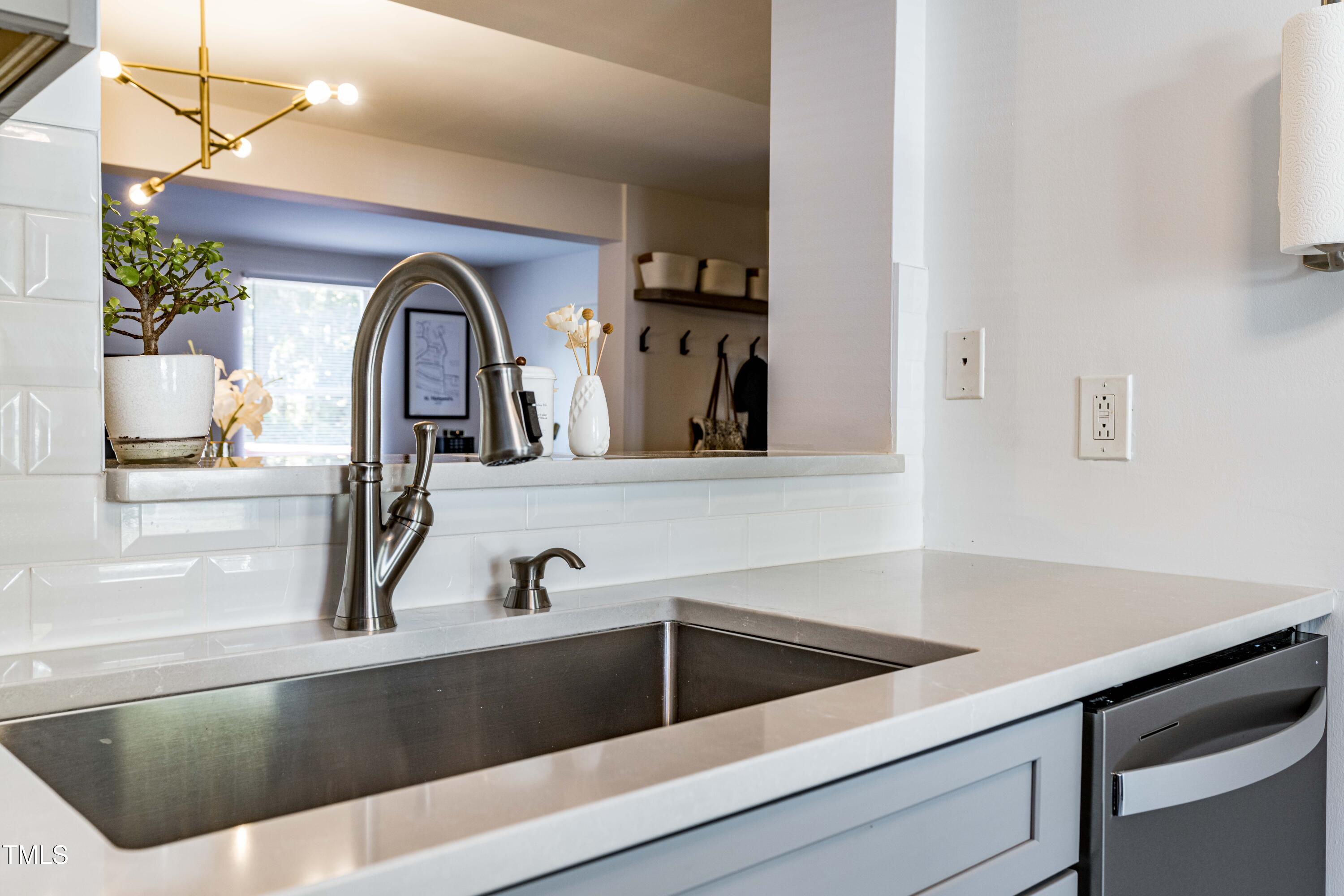 1708 Ithaca Lane, Unit A Raleigh, NC 27606 - Photo 11 of 30 a kitchen with a sink and a window