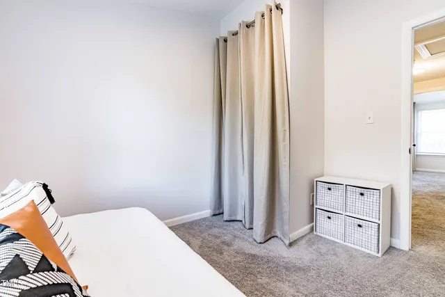 a view of a bedroom with closet