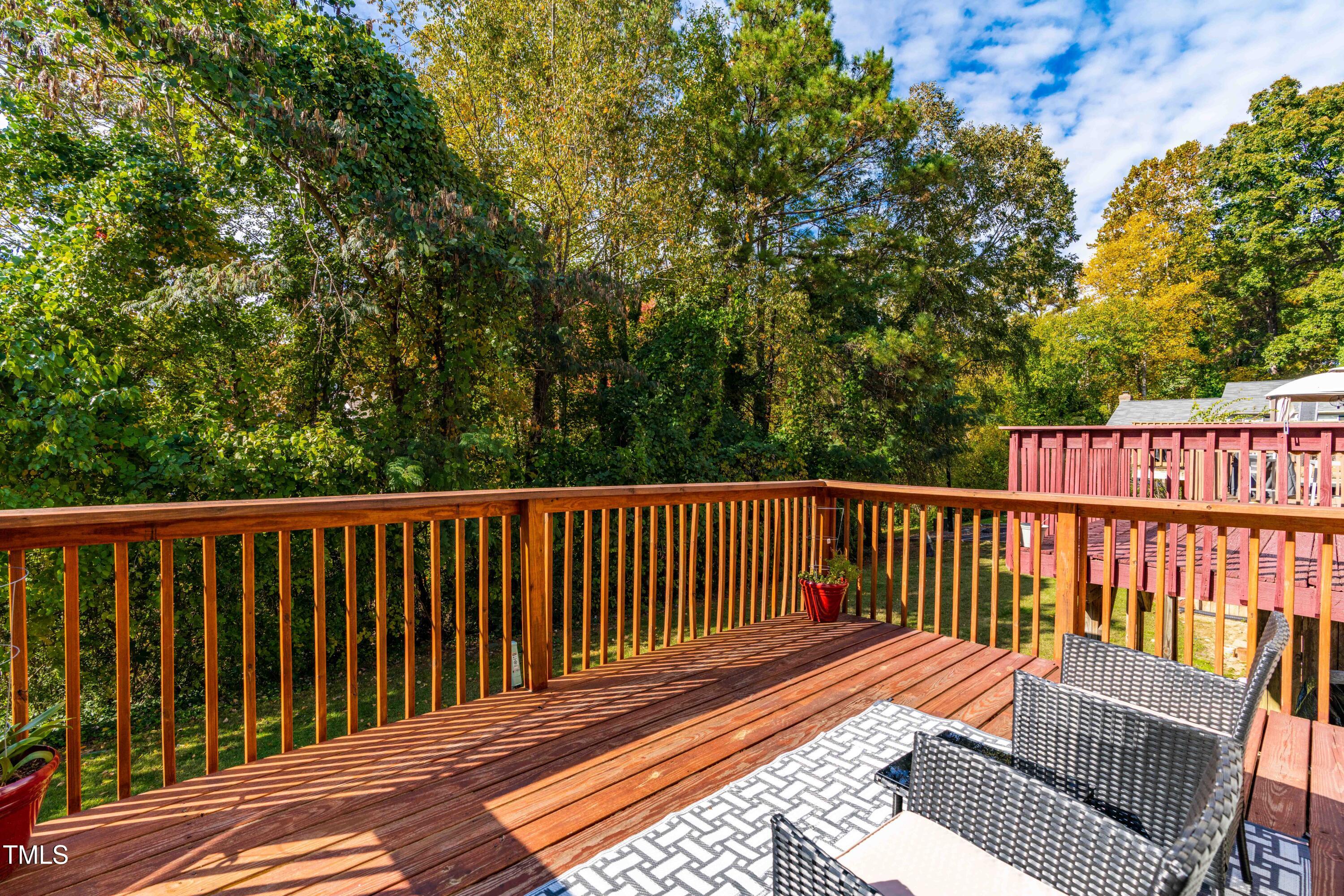 1708 Ithaca Lane, Unit A Raleigh, NC 27606 - Photo 29 of 30 a balcony with wooden floor and fence