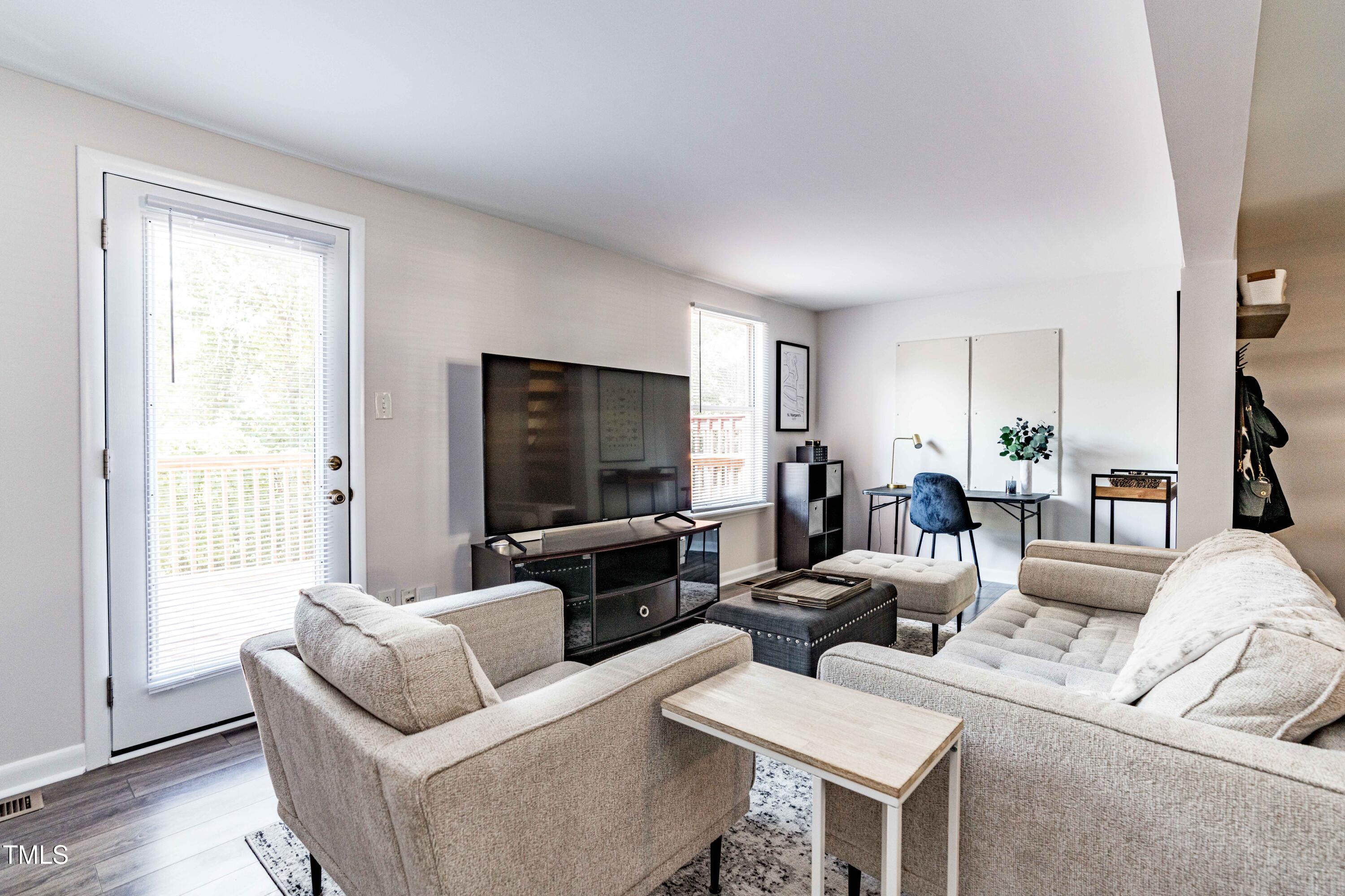 1708 Ithaca Lane, Unit A Raleigh, NC 27606 - Photo 4 of 30 a living room with furniture and a flat screen tv