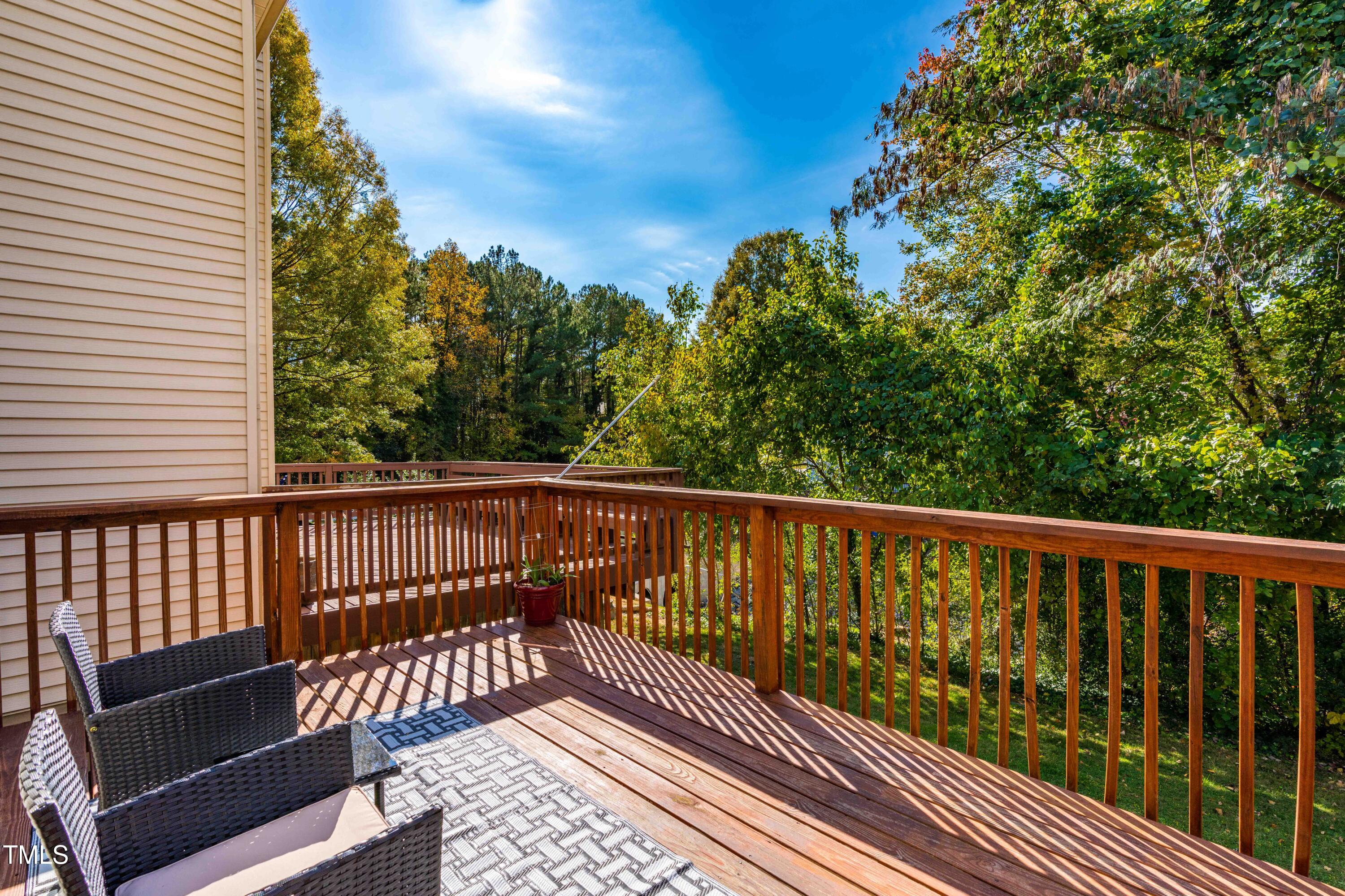 1708 Ithaca Lane, Unit A Raleigh, NC 27606 - Photo 5 of 30 a balcony with wooden floor and fence
