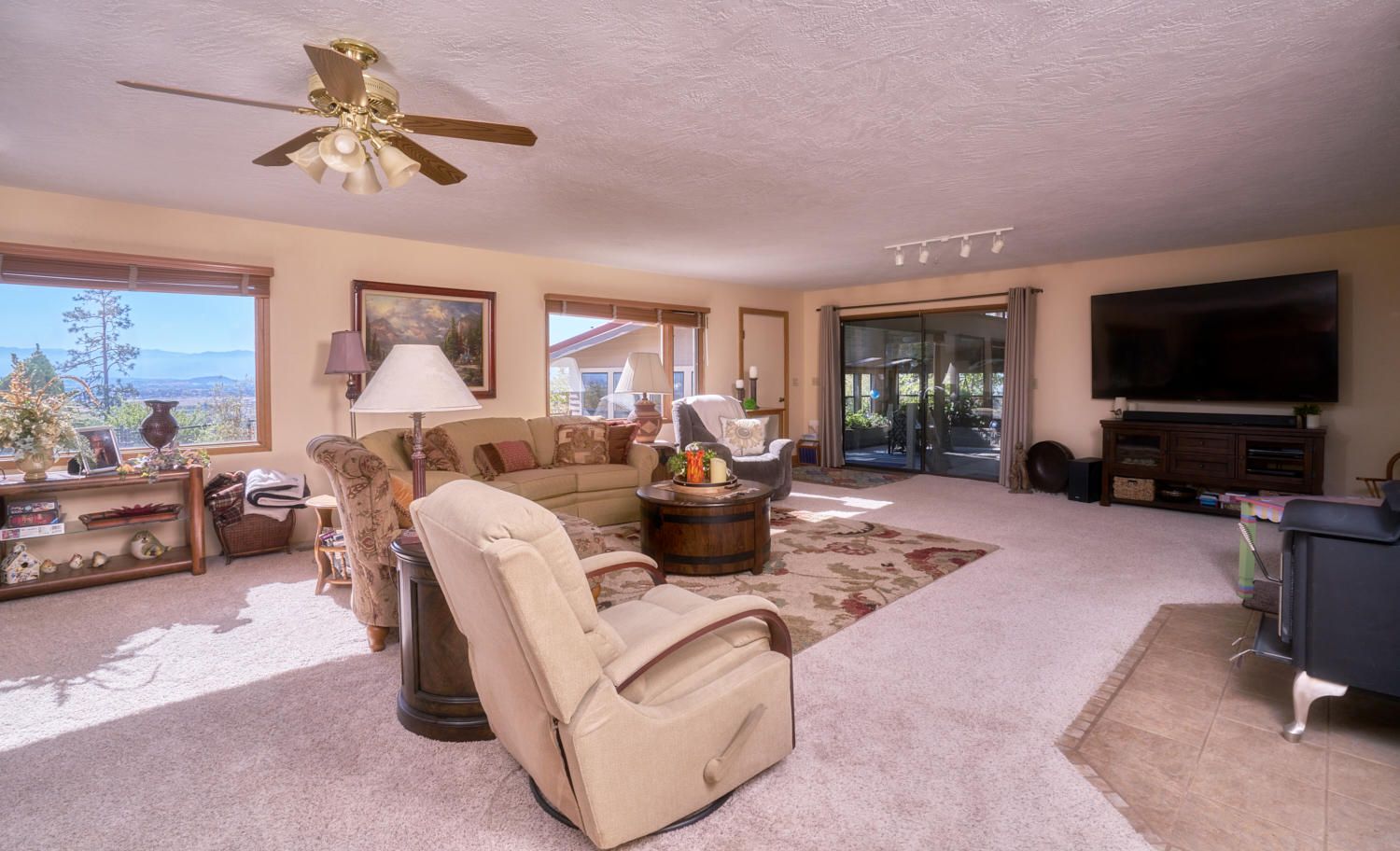 150 Nick Young Road Eagle Point, OR 97524 - Photo 26 of 41 a living room with furniture and a flat screen tv