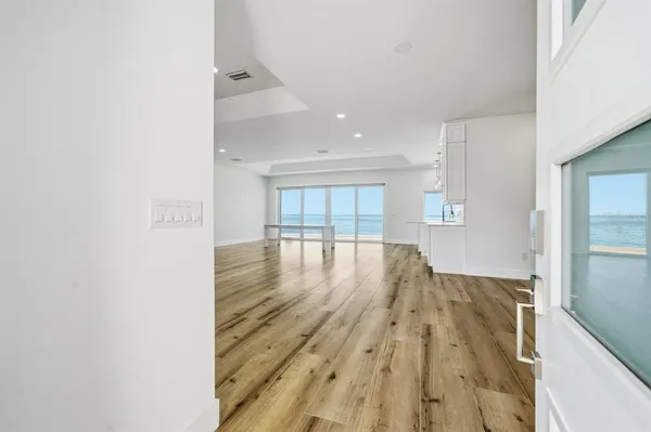 a view of a room with wooden floor
