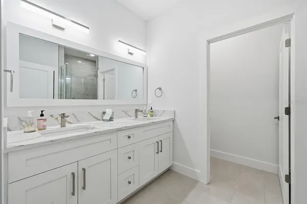 a bathroom with a glass shower door