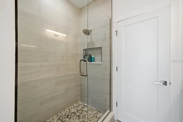 a view of kitchen and hall with wooden floor