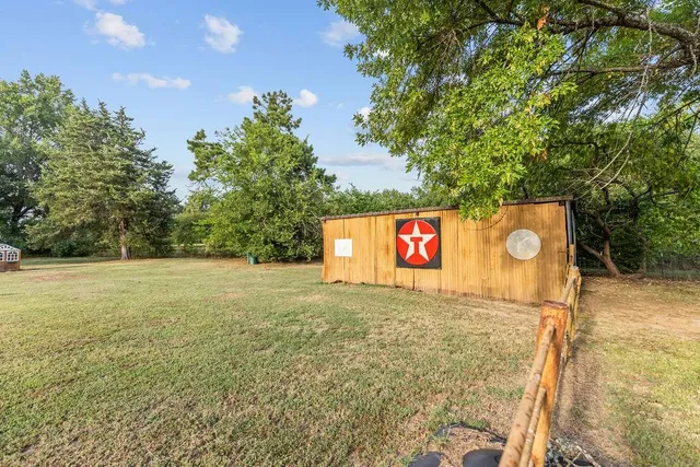 a view of a street with trees in the background