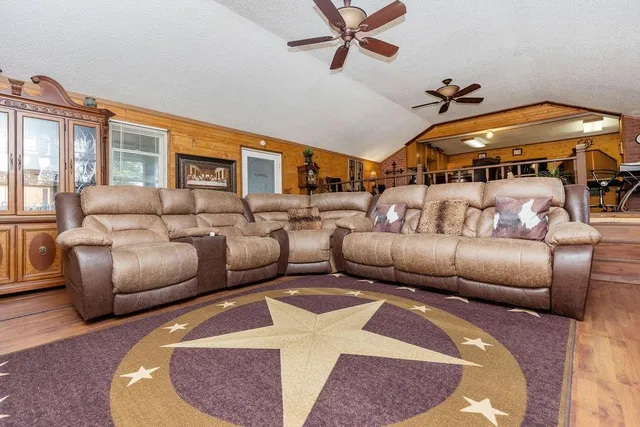 a living room with furniture and a table