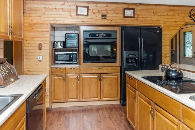 a kitchen with stainless steel appliances granite countertop a stove and a sink