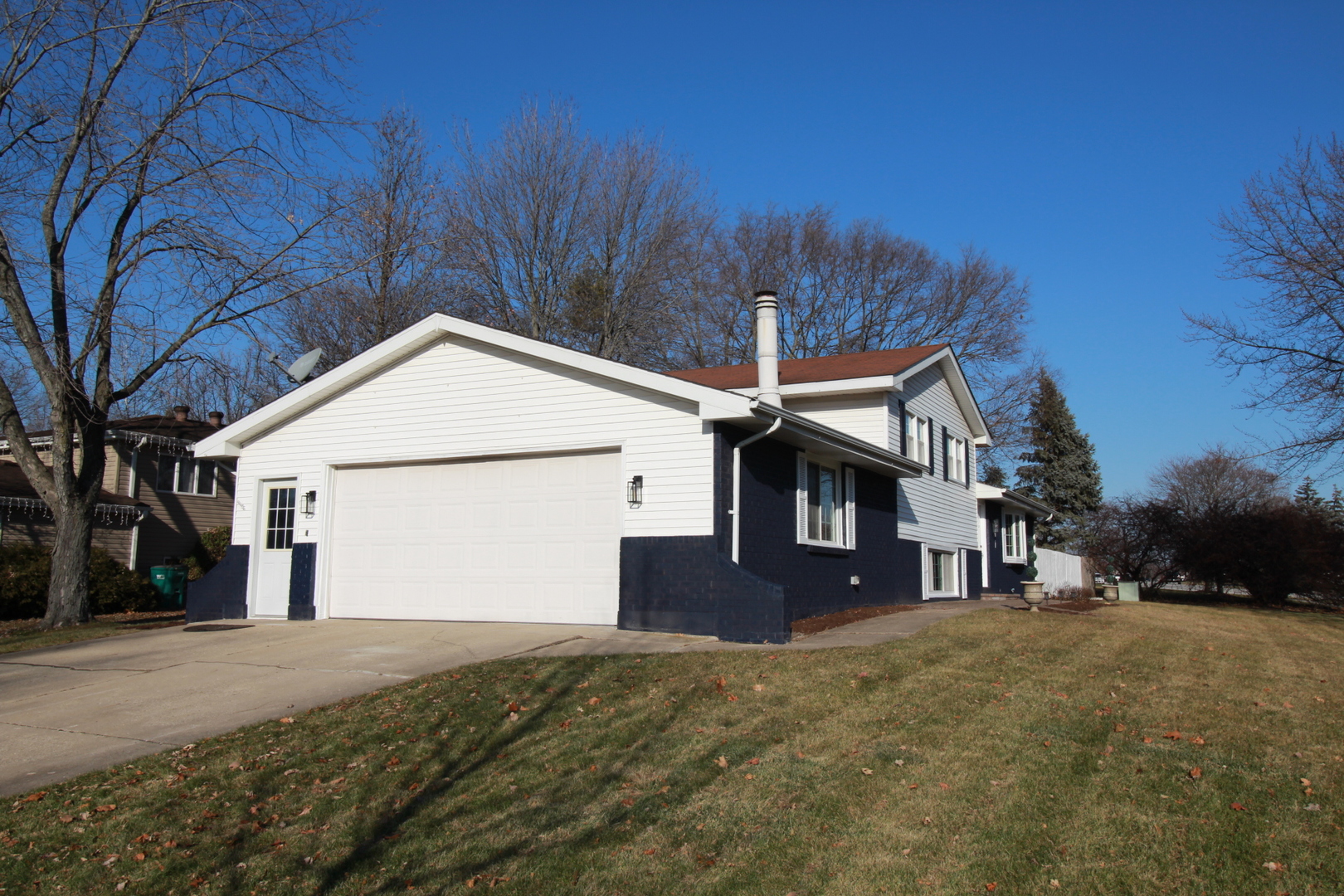801 South Raven Road Shorewood, IL 60404 - Photo 3 of 5 a front view of a house with a yard and garage
