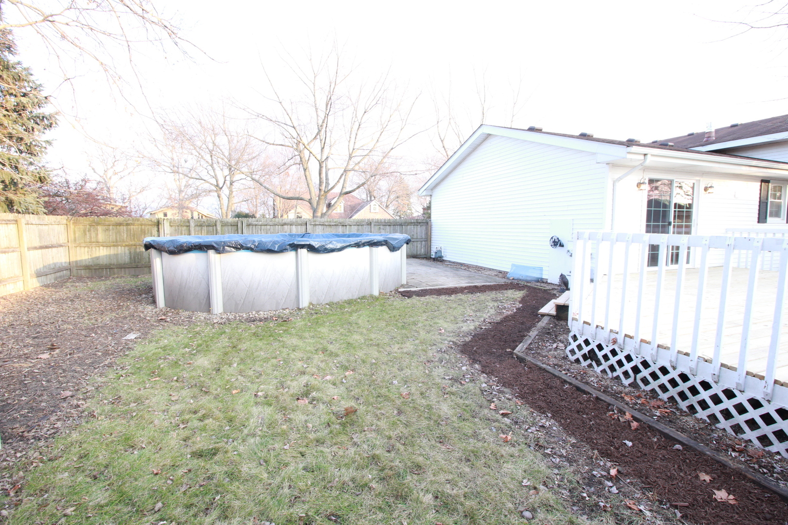801 South Raven Road Shorewood, IL 60404 - Photo 5 of 5 a view of a backyard with wooden fence