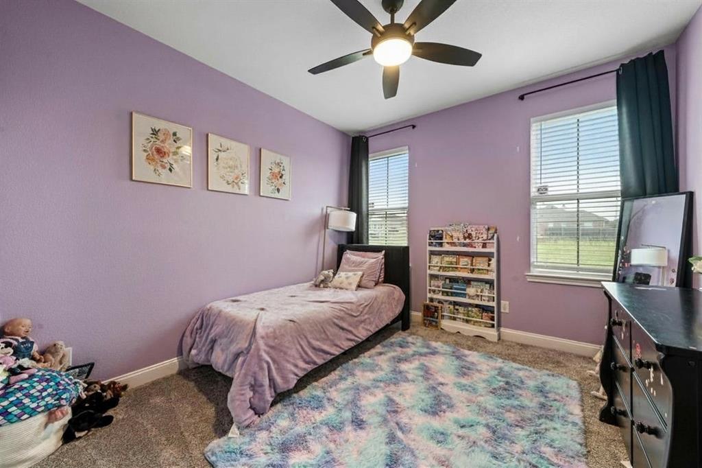 820 Forward Pass Drive Hewitt, TX 76643 - Photo 15 of 22 a bedroom with a bed dresser and a chair
