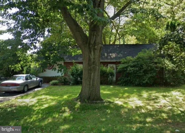 a view of a backyard with a fountain