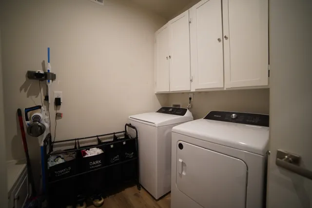 a view of storage and utility room with washer and dryer