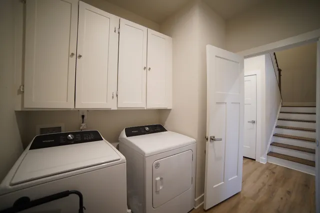 a view of storage and utility room with washer and dryer