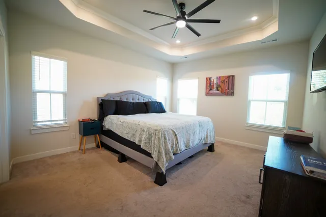 a bedroom with a bed furniture and a window