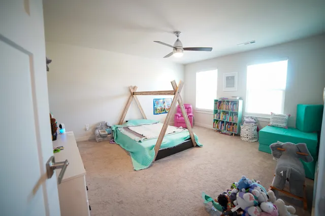 a bedroom with furniture and a bed