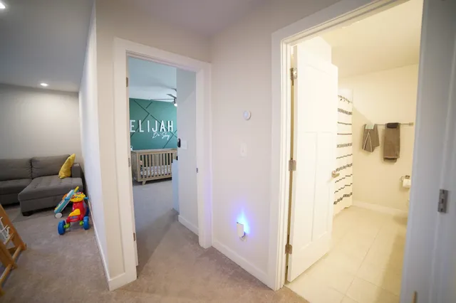 a view of a livingroom with furniture and an entryway