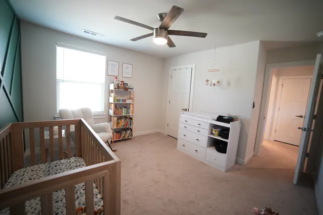 a bedroom with furniture and white walls