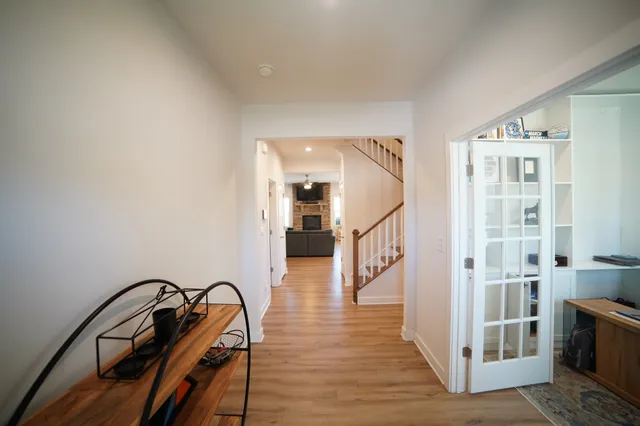a view of a hallway with seating area