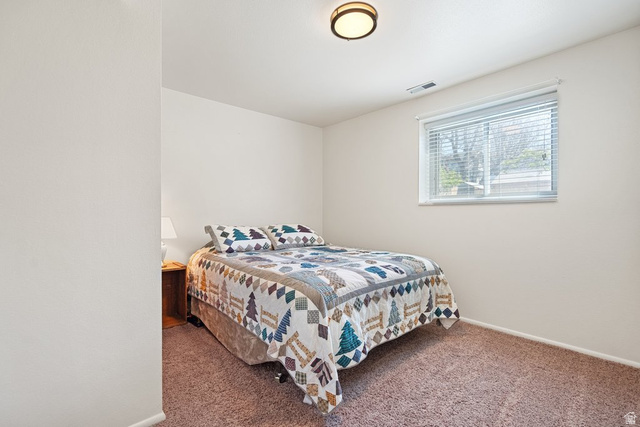 865 South 325 West Orem, UT 84058 - Photo 15 of 38 Bedroom featuring neutral tone walls, brown carpeting, and a window with blinds