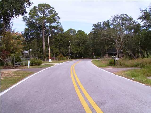 144 My Way, Unit B Santa Rosa Beach, FL 32459 - Photo 11 of 26 a view of a swimming pool with a yard and palm trees