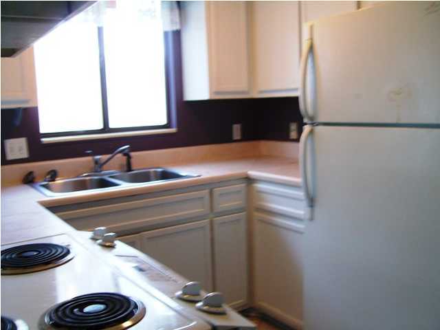 144 My Way, Unit B Santa Rosa Beach, FL 32459 - Photo 13 of 26 a close view of sink and mirror in a bathroom
