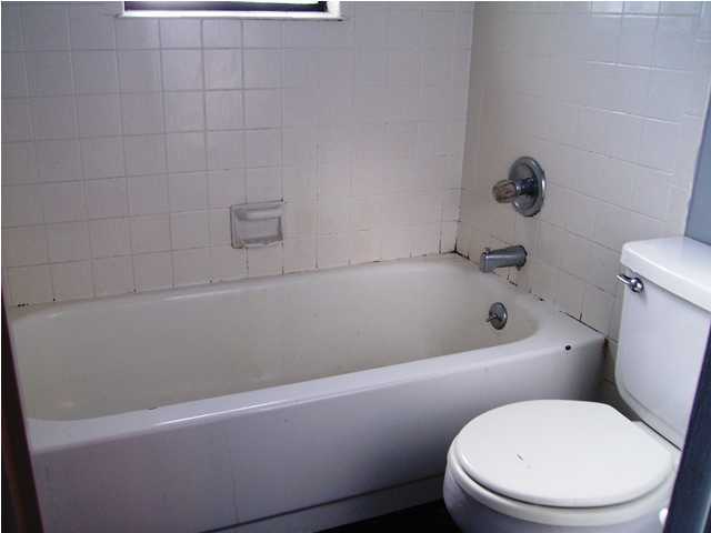 144 My Way, Unit B Santa Rosa Beach, FL 32459 - Photo 21 of 26 a white bath tub sitting next to a white toilet and sink